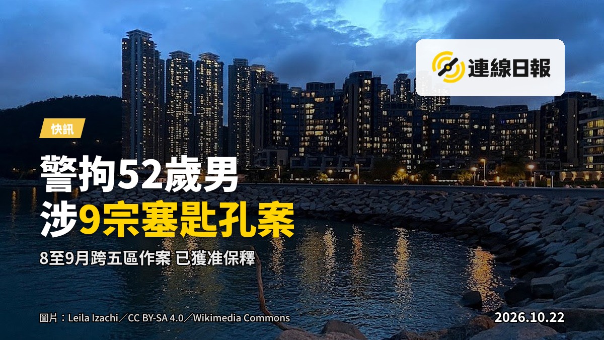 將軍澳公屋大廈住宅單位大門，匙孔清晰可見，走廊空無一人。